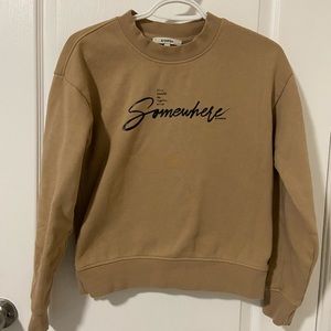 Beautiful crewneck sweatshirt in tan color with black writing size XS
